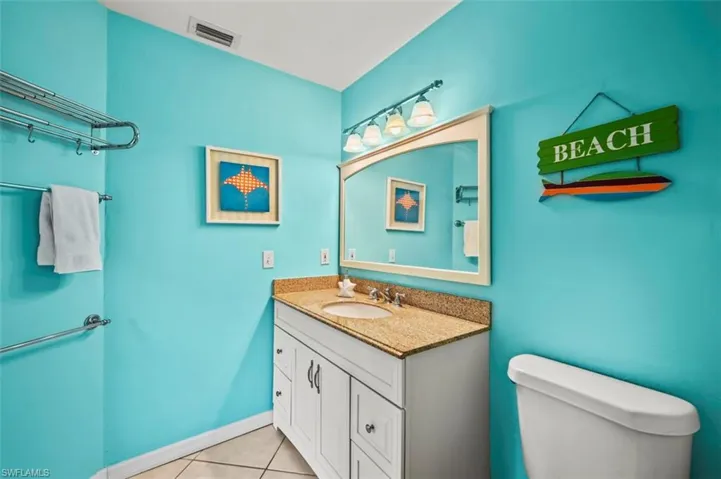 Bathroom with vanity and tile patterned flooring