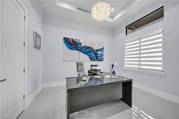 Modern room featuring light-colored walls and polished flooring