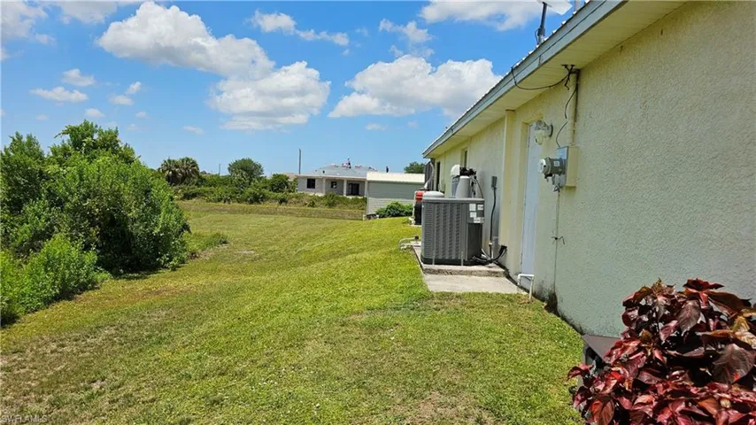View of yard with central air condition unit