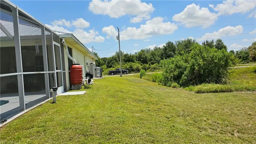 View of yard featuring a lanai