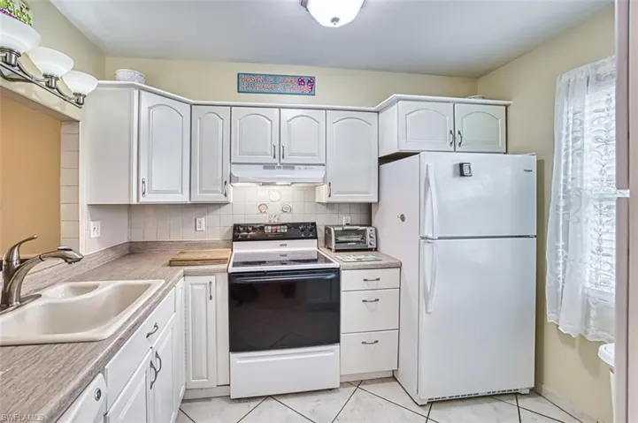 Kitchen with white appliances