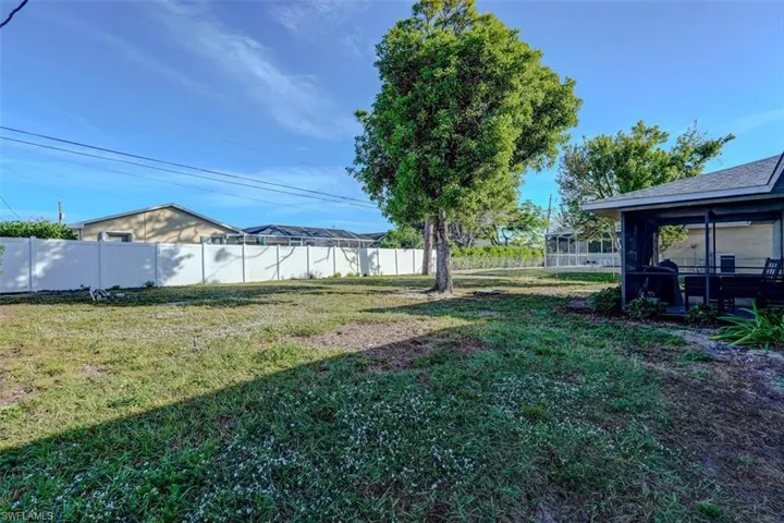 View of yard featuring a sunroom