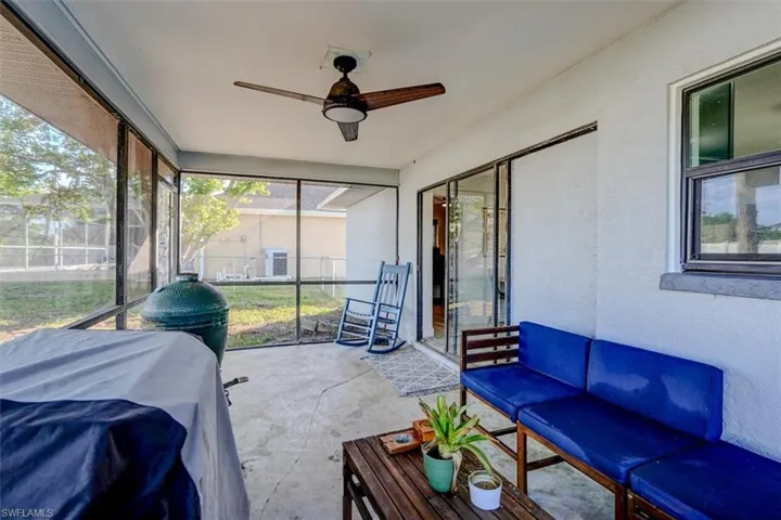 Sunroom / solarium featuring ceiling fan