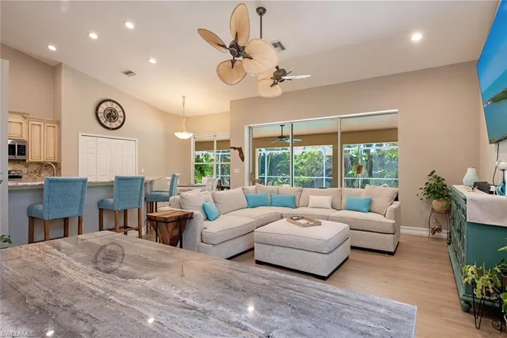 Open floor plan with volume ceilings