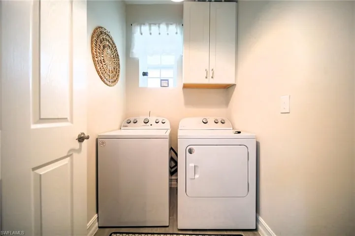 Nice Sized Laundry Room With Built-In Cabinets!