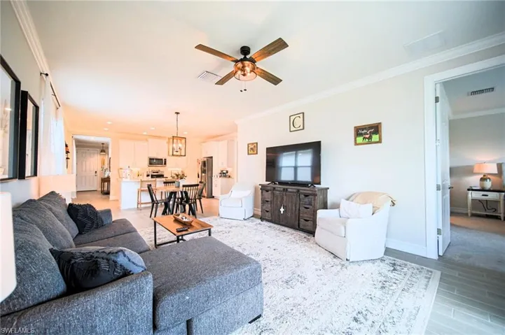 The Living Room Has A Great View Of The Screened-In Lanai And Has Custom Lighting And Is Fully Furnished With All That You Need To Have That Florida Experience!
