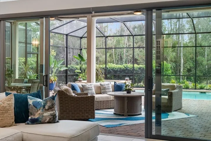 Sunroom featuring a ceiling fan