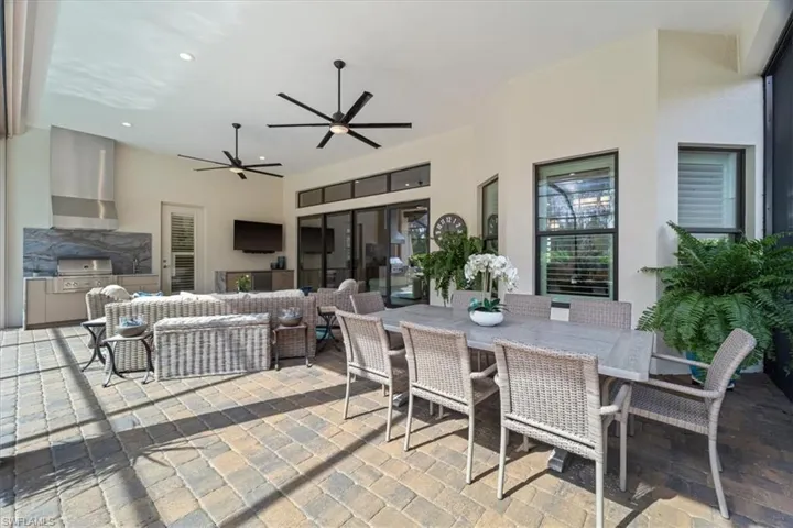 View of patio / terrace featuring ceiling fan, a grill, an outdoor hangout area, and outdoor dining space
