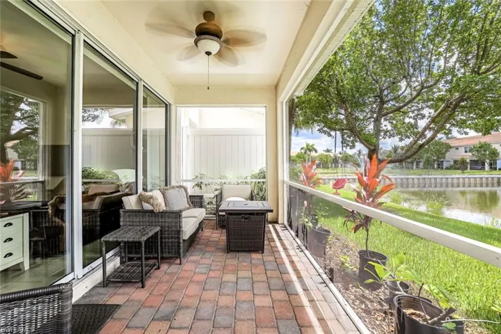 Sunroom featuring ceiling fan