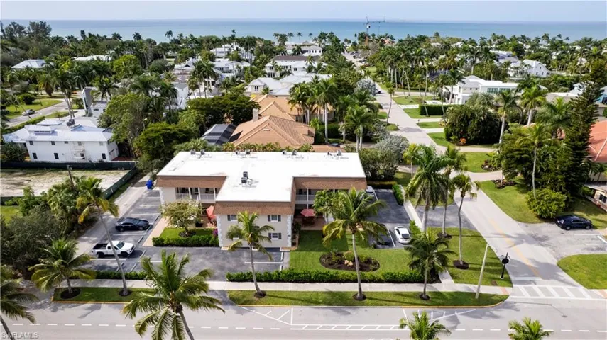 Aerial view featuring a residential view and a water view