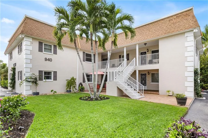View of property featuring stairway
