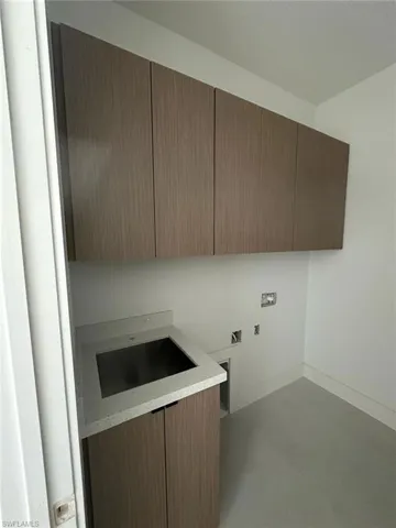 Washroom featuring cabinets and washer hookup