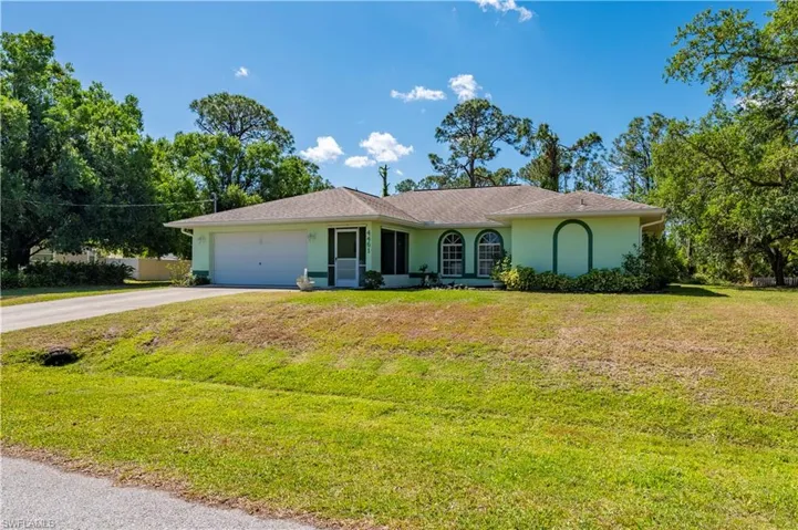 Detached garage with a wall mounted air conditioner