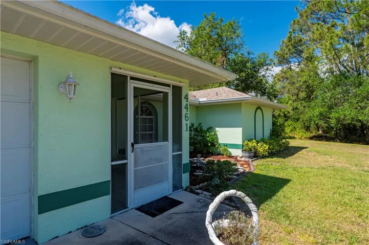 Sunroom with ceiling fan and outdoor dining area.  Great place to dine, relax and gather.