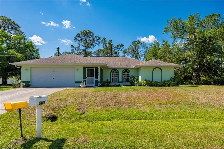 Aerial view home on a double lot.  Home with 2-car attached garage and detached garage and shed for recreational vehicles.