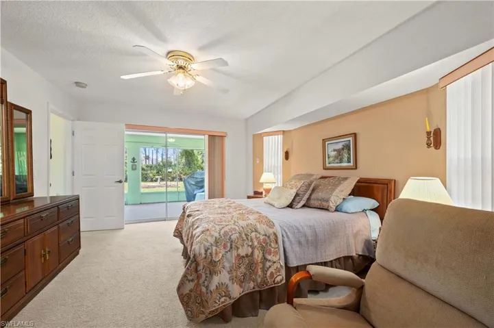 Expansive Sunroom with ceiling fan overlooking private back yard