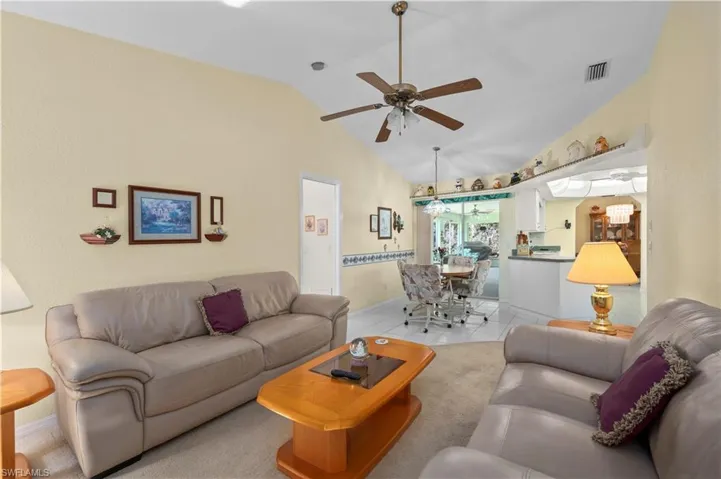 Washroom with cabinet space, washer and clothes dryer, deep sink and extra refrigerator.