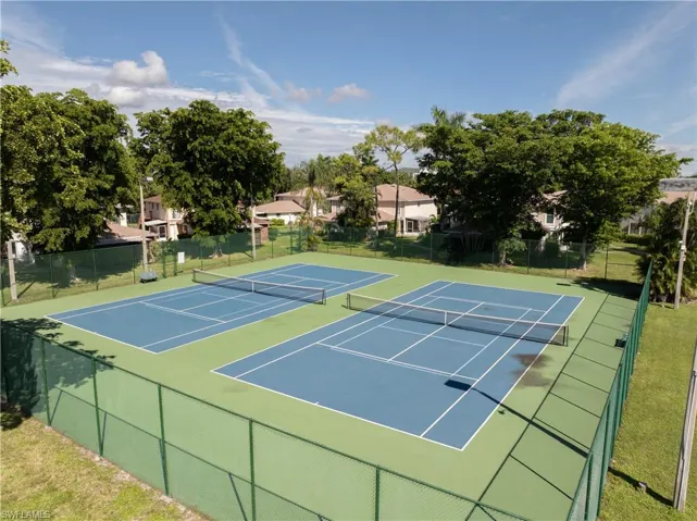View of tennis court featuring community basketball court