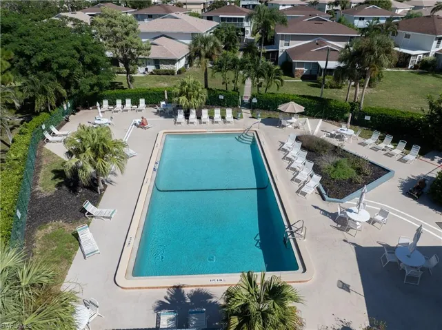 Community pool featuring a patio