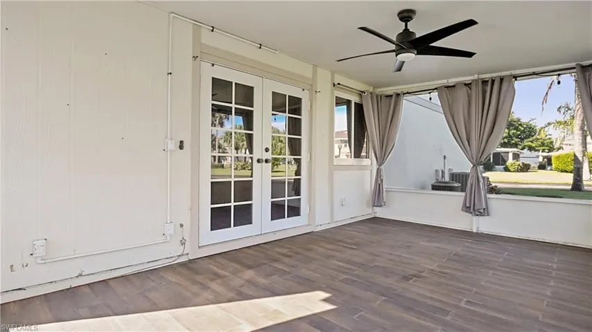 Unfurnished sunroom featuring french doors and healthy amount of natural light