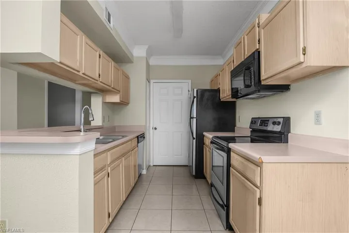 view toward laundry room at the end of the kitchen