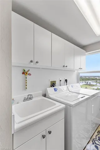 Deep tub and storage in the laundry room.