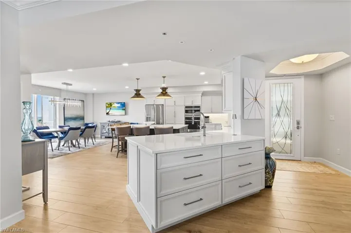 This completely REDESIGNED kitchen offers Quartz countertops, Oversized Quartz island with lots of storage, Custom lighting Induction cooktop. Custom lighting!