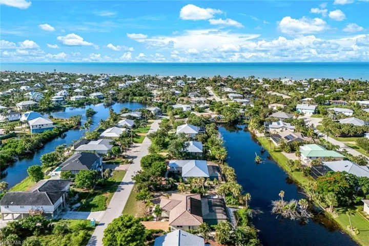 Aerial perspective of suburban area with a large body of water