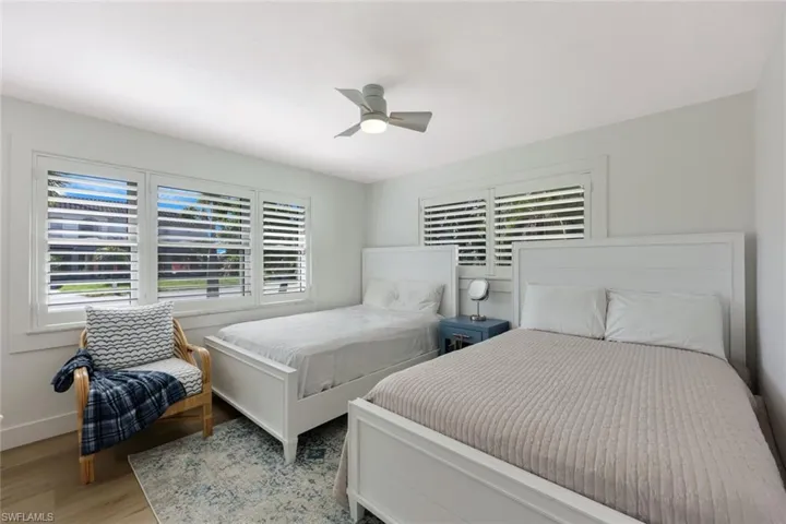 Bedroom with wood finished floors and ceiling fan