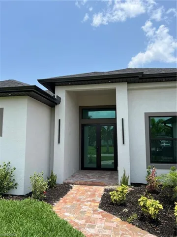 Entrance to property featuring french doors
