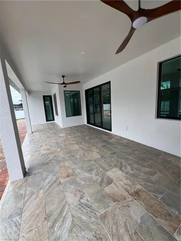 View of terrace featuring ceiling fan