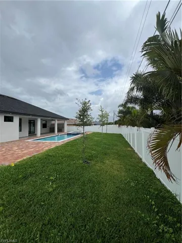 View of yard featuring a fenced in pool