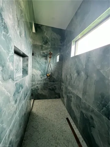 Bathroom with tiled shower