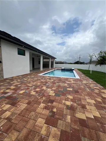 View of pool with a patio area