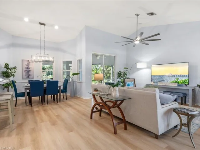 Open floor plan - great room and dining area; new LED retrofit can lights and dining light fixture on a dimmer.