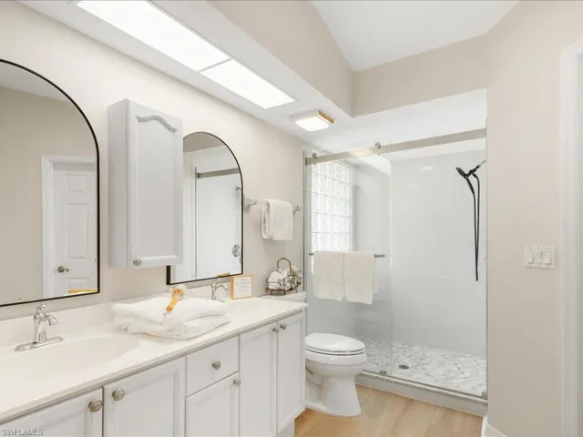 Dual vanities and newly installed shower floor tile