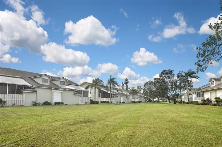 View of yard with a sunroom