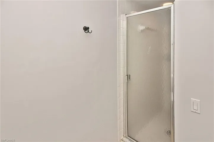 Bathroom with a shower with shower door
