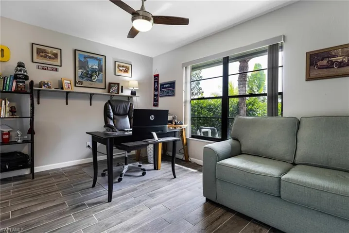 Office space featuring hardwood / wood-style floors and ceiling fan