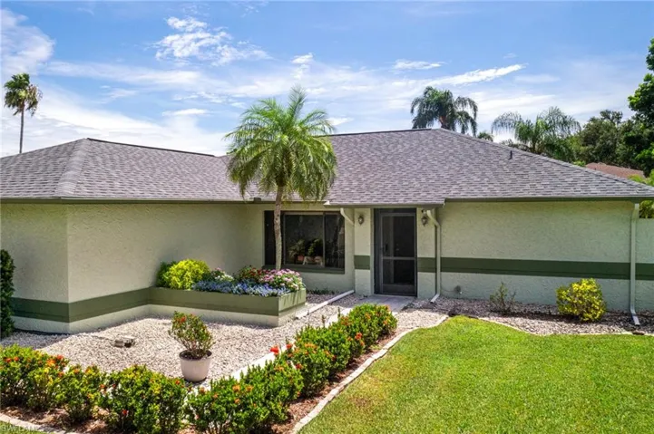 View of front of property with a front lawn