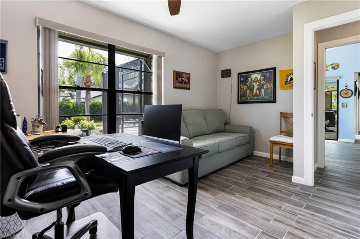 Office space with hardwood / wood-style flooring