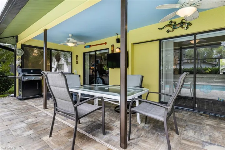 View of patio featuring ceiling fan and grilling area