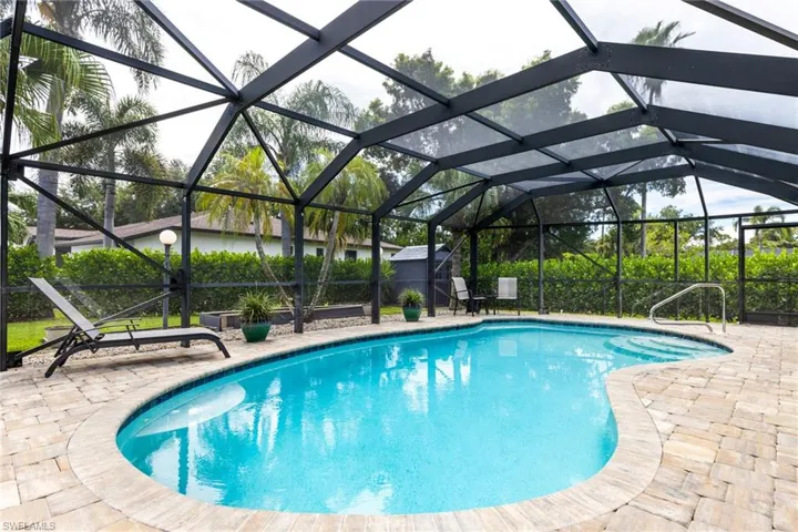 View of pool featuring a lanai and a patio area