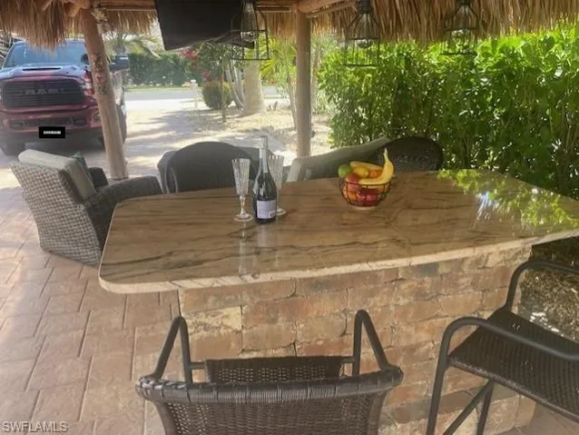 View of patio with outdoor dry bar