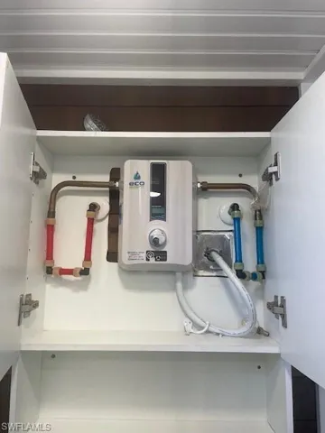 Utility room with tankless water heater