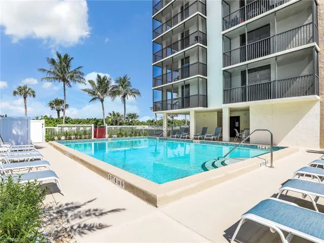 Community pool featuring a patio