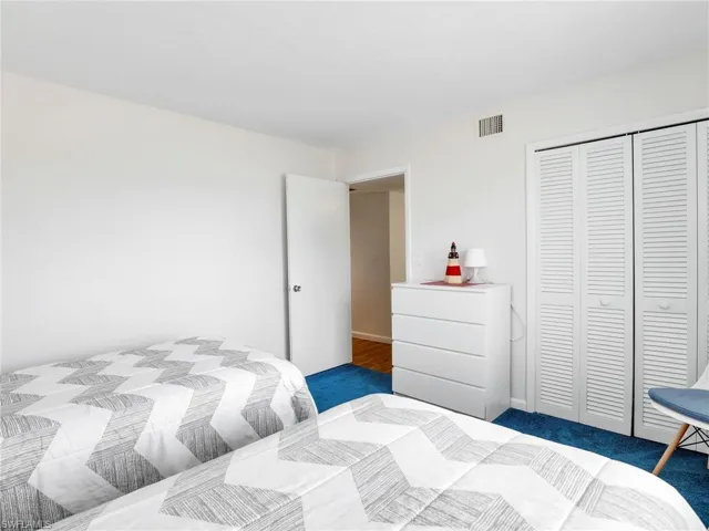 Bedroom featuring a closet and carpet