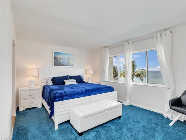 Carpeted bedroom with baseboards