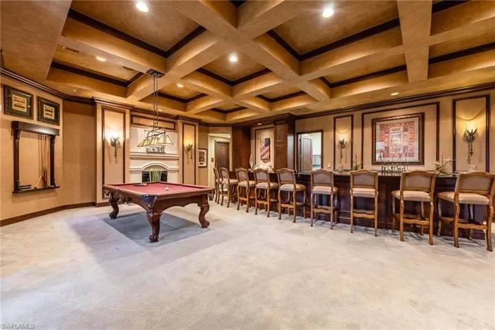 Rec room featuring billiards, coffered ceiling, and a bar, great for a game night with family & friends!