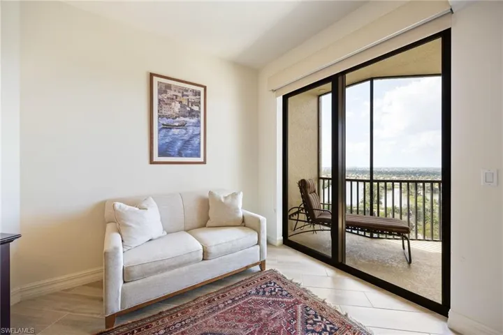 Primary Bedroom sitting area with views and entry onto the lanai.
